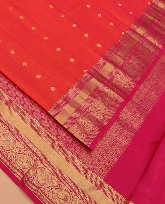 Orange Vasundhara Lite Silk Mix Saree Enriched with Zari Buttas, Featuring a Contrast Border of Thilakam, Banaras, Muthu, and Kodi Visiry Designs, Zari Elevated Pallu, and a Contrast Blouse
