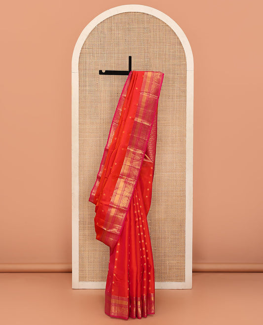 Orange Vasundhara Lite Silk Mix Saree Enriched with Zari Buttas, Featuring a Contrast Border of Thilakam, Banaras, Muthu, and Kodi Visiry Designs, Zari Elevated Pallu, and a Contrast Blouse