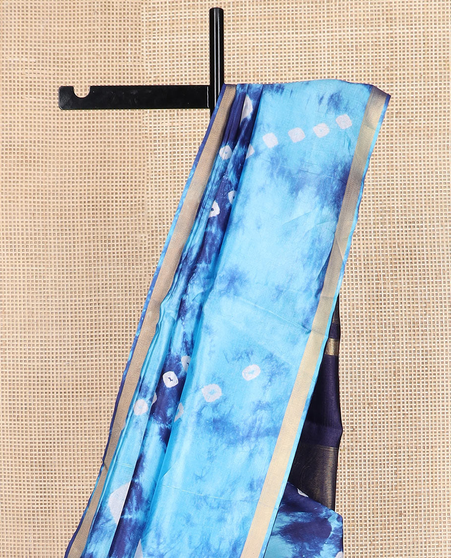 Blue shibori printed banana pith saree, zari piping border, and zari striped pallu