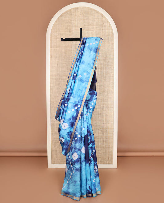 Blue shibori printed banana pith saree, zari piping border, and zari striped pallu