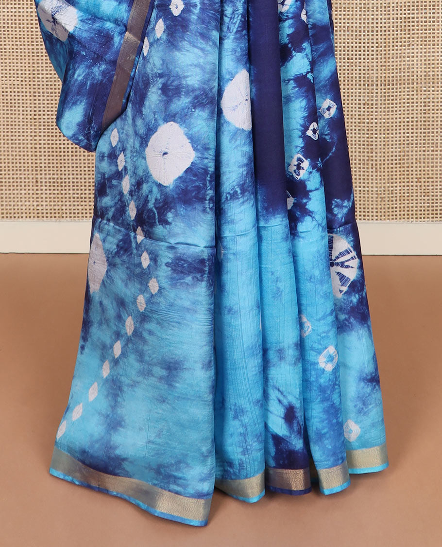 Blue shibori printed banana pith saree, zari piping border, and zari striped pallu