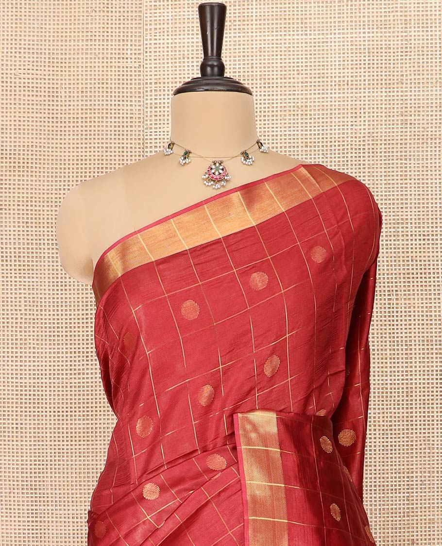 Red Banana Pith Saree Mesmerized with Polka Dot Buttas Enclosed Checks, Subtle Zari Border, Gleaming Zari Stripes Woven Pallu, and Paired with a Matching Plain Blouse