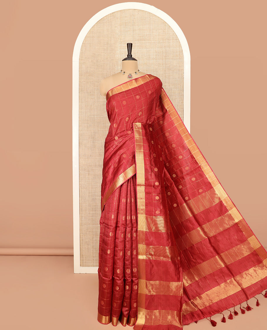 Red Banana Pith Saree Mesmerized with Polka Dot Buttas Enclosed Checks, Subtle Zari Border, Gleaming Zari Stripes Woven Pallu, and Paired with a Matching Plain Blouse