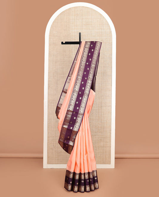 Peach butta silk saree, contrast border of rekku, diamond, muthu, and mayil chakram designs, and jaal pallu