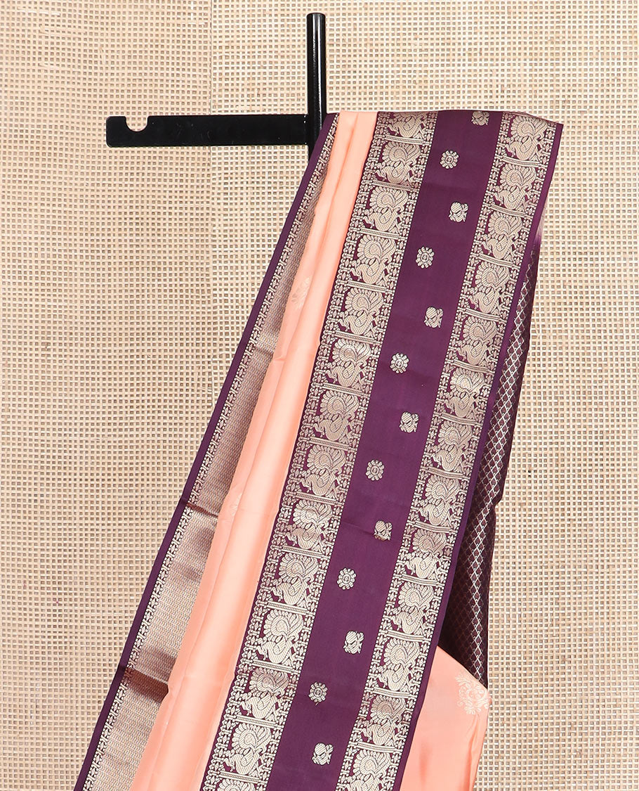 Peach butta silk saree, contrast border of rekku, diamond, muthu, and mayil chakram designs, and jaal pallu