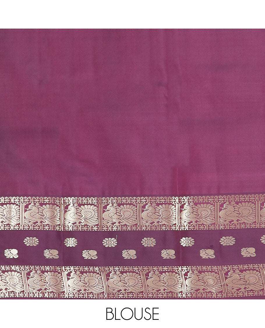 Peach butta silk saree, contrast border of rekku, diamond, muthu, and mayil chakram designs, and jaal pallu