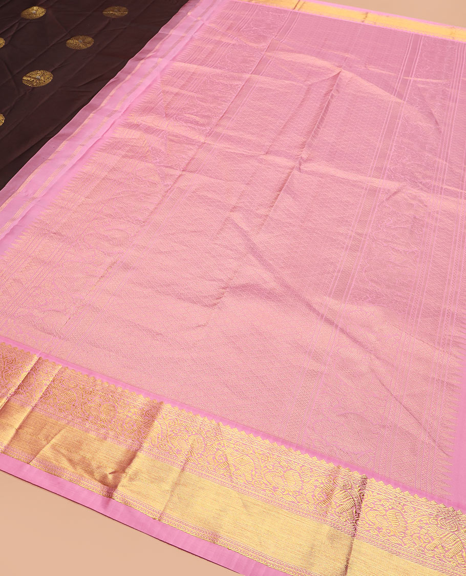 Brown round mayil buttas silk saree, contrast border of thilakam mokku, yaanai, and mayil designs, and jaal pallu