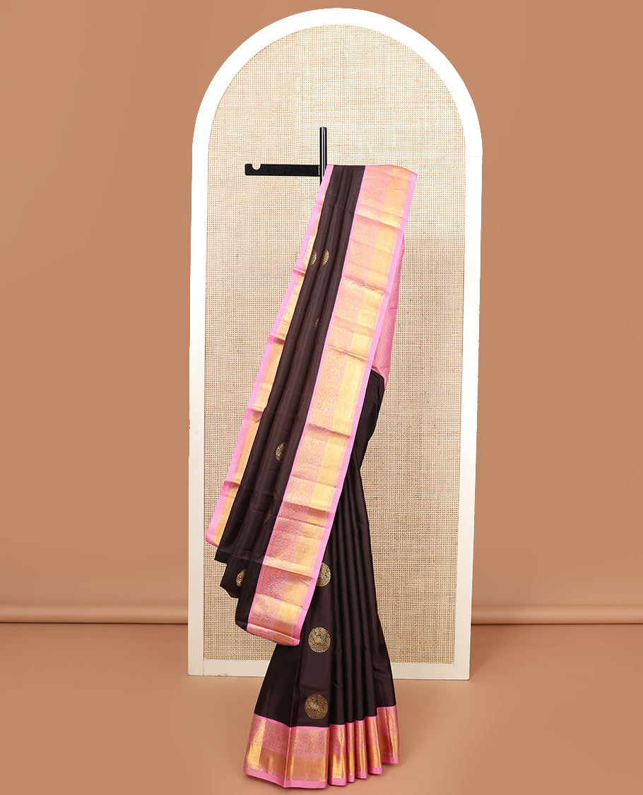 Brown round mayil buttas silk saree, contrast border of thilakam mokku, yaanai, and mayil designs, and jaal pallu