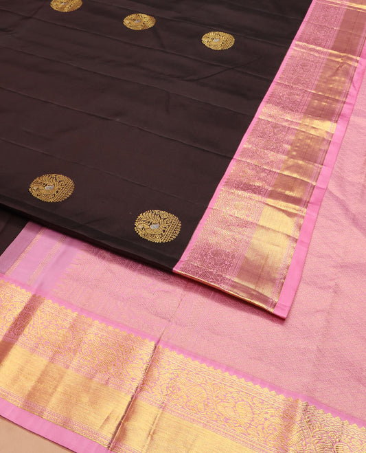 Brown round mayil buttas silk saree, contrast border of thilakam mokku, yaanai, and mayil designs, and jaal pallu