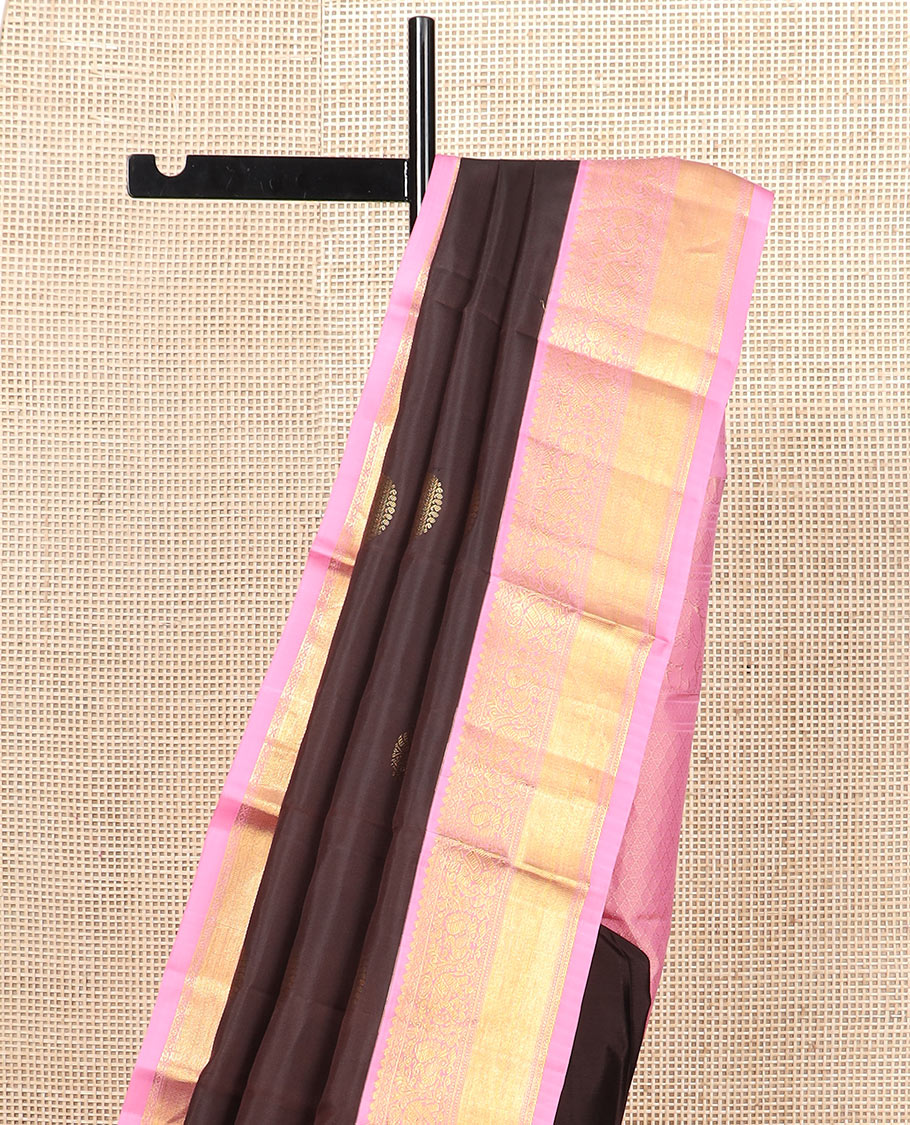 Brown round mayil buttas silk saree, contrast border of thilakam mokku, yaanai, and mayil designs, and jaal pallu