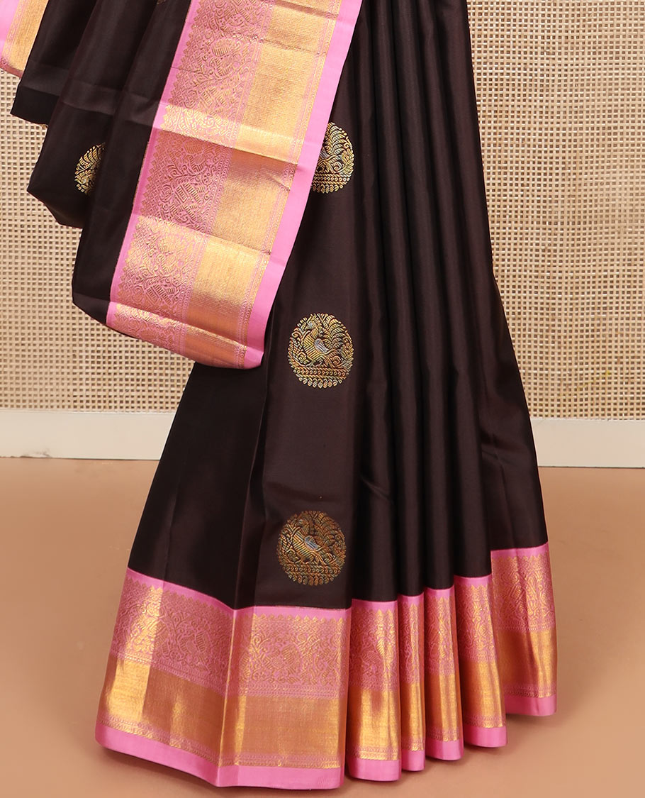 Brown round mayil buttas silk saree, contrast border of thilakam mokku, yaanai, and mayil designs, and jaal pallu