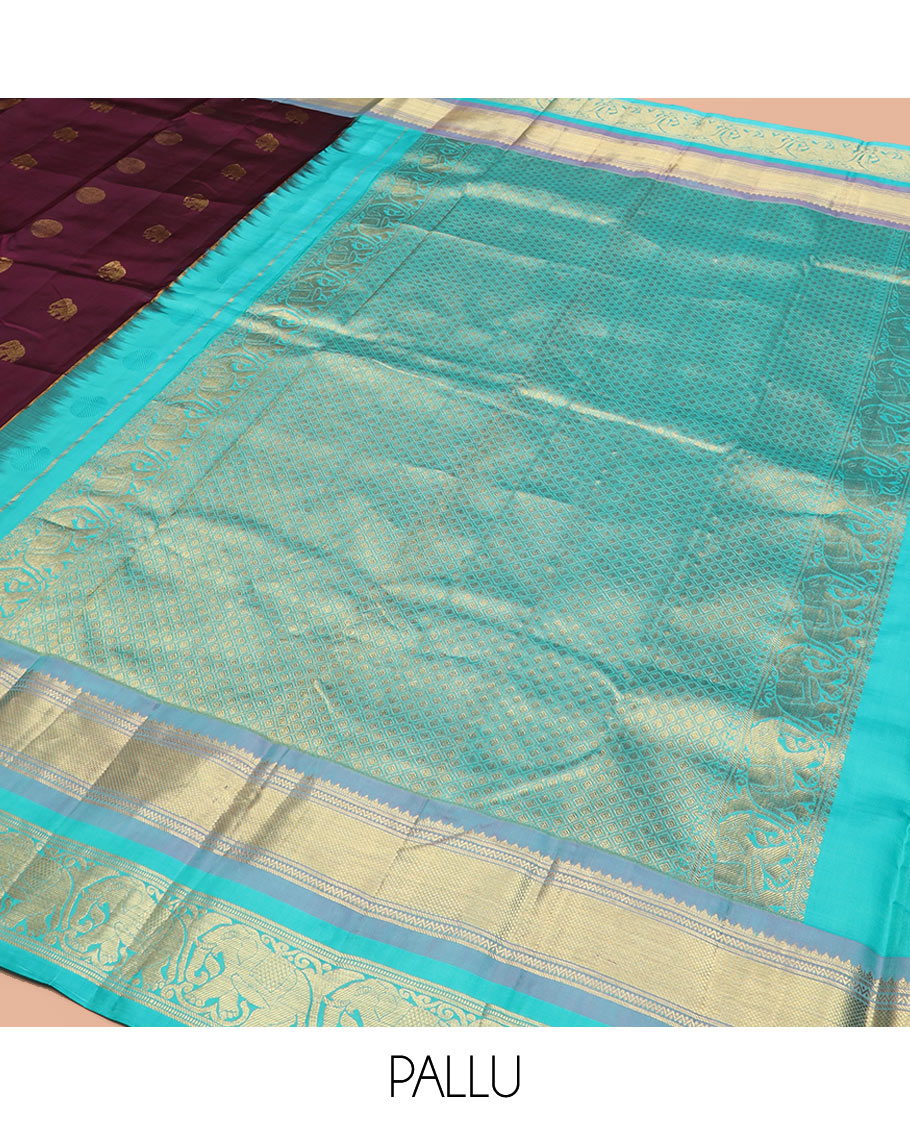 Purple Vasundhara Silk Saree Beautified with Yaanai and Poun Buttas, Complemented by a Contrast Border of Neli, Mayil Kann, Muthu, Banaras, and Yaanai Designs, Pallu Woven in Jaal Design, and Paired with a Contrast Blouse