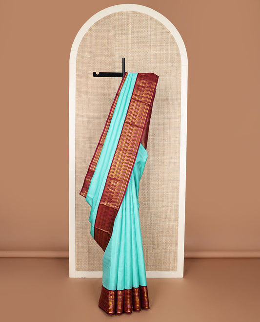 Baby blue zari buttas silk saree, contrast border of manga mokku,banaras,kamalam & rettai neli & jaal pallu