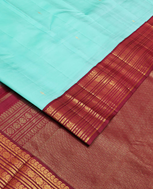 Baby blue zari buttas silk saree, contrast border of manga mokku,banaras,kamalam & rettai neli & jaal pallu