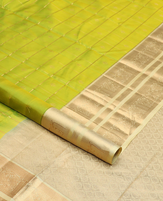 Green zari buttas silk saree, contrast border of kuyil kann, banaras, and mayil designs, and ogee patterned pallu