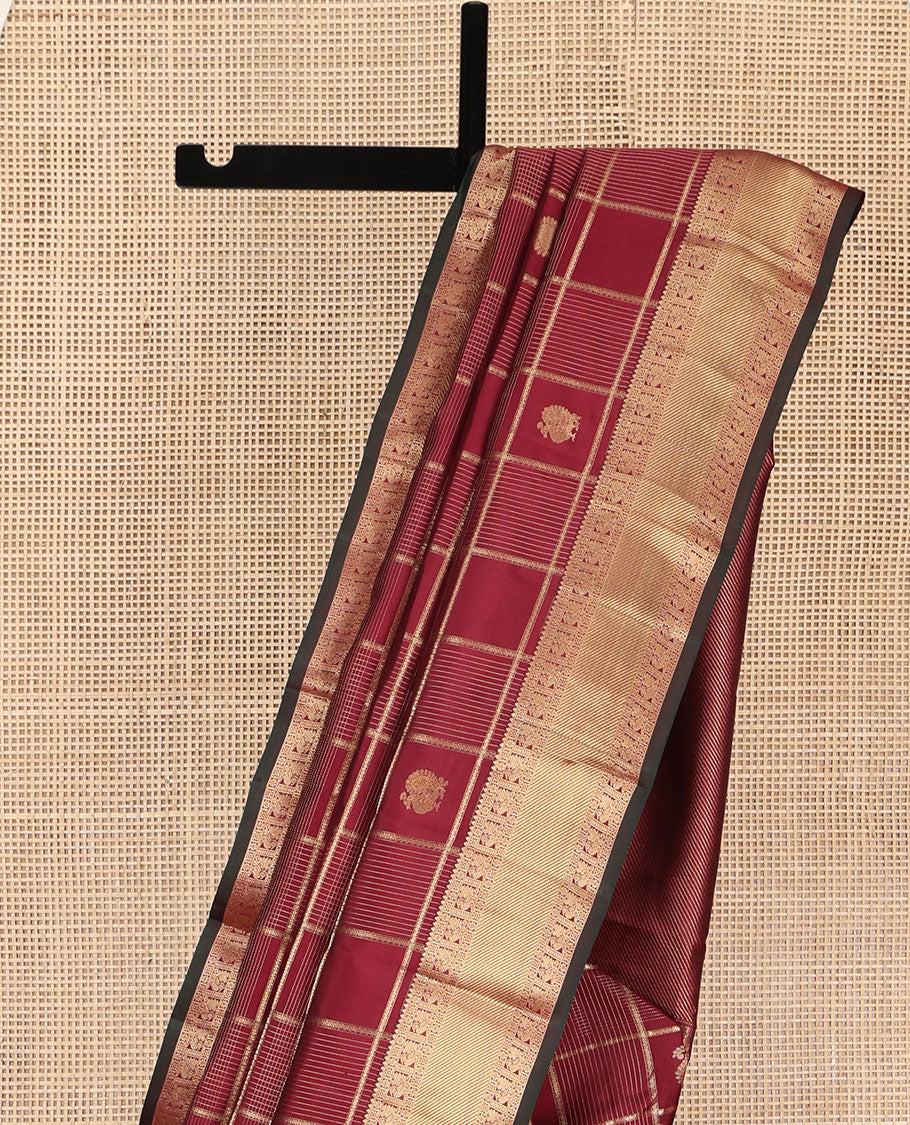 Maroon Vasundhara Silk Saree, Embellished with Zari Buttas and Zari Checks All Over Its Body, Highlighted  by a Zari Border of Rekku, Kamalam, Diamond, and Mayil Designs, Diagonally Zari Striped Pallu, and Paired with a Contrast Blouse