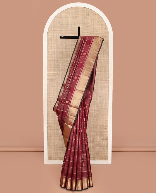 Maroon Vasundhara Silk Saree, Embellished with Zari Buttas and Zari Checks All Over Its Body, Highlighted  by a Zari Border of Rekku, Kamalam, Diamond, and Mayil Designs, Diagonally Zari Striped Pallu, and Paired with a Contrast Blouse