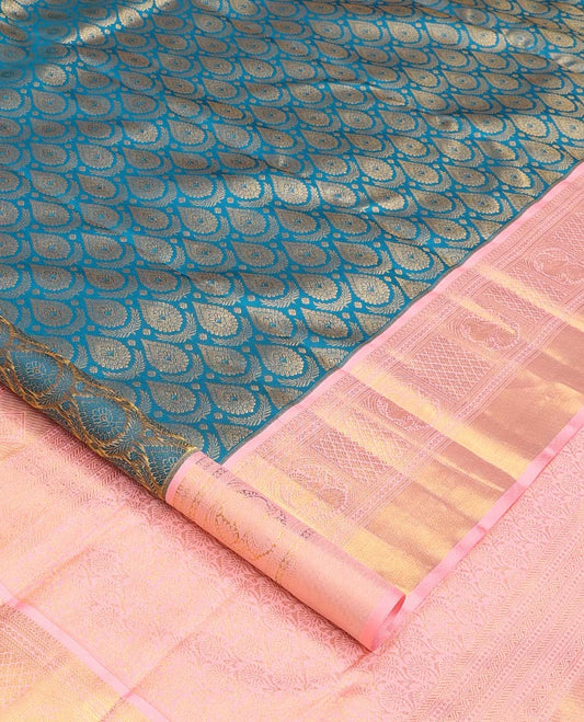 Blue jacquard wedding silk saree, contrast zari border of neli, banaras, jaal, and mayil designs, and floral design pallu