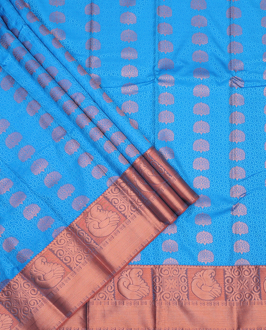 Azure blue art silk pavadai set, embossed, zari buttas and contrast traditional zari bordered skirt and a contrast dual-toned zari border blouse