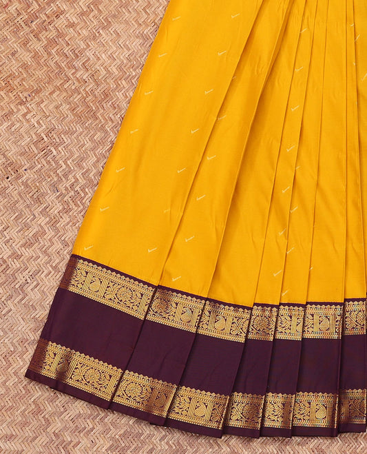 Yellow Budget Silk Saree, Sparsely Sparkled with Zari Buttas All Over Its Body, Complemented by a Contrast Traditional Zari Design Rettai Pettu Border, Grand Jaal Pallu, and Paired with a Contrast Blouse