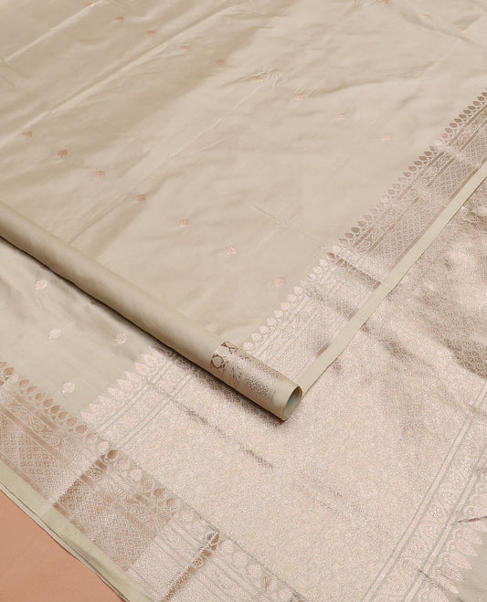 Cream buttas kathan silk saree, traditional zari border, and intricately designed pallu