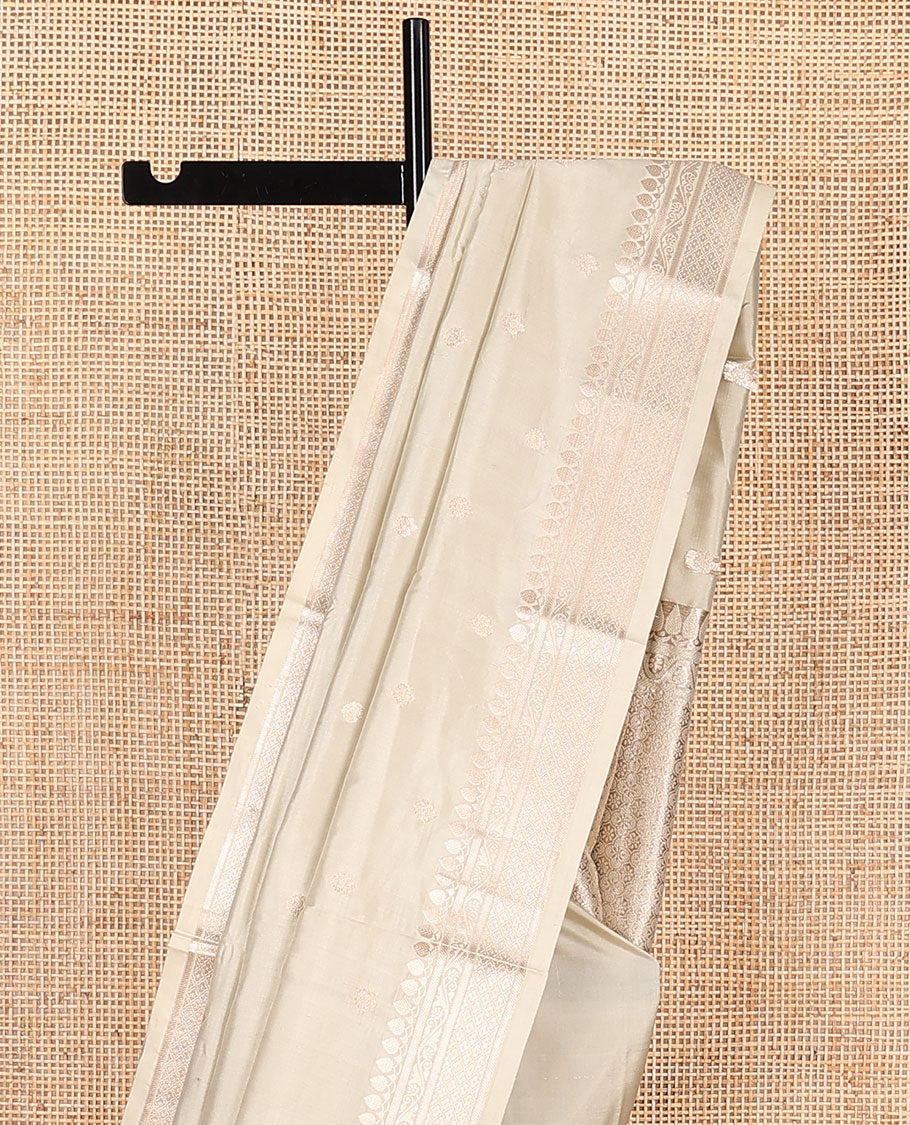 Cream buttas kathan silk saree, traditional zari border, and intricately designed pallu