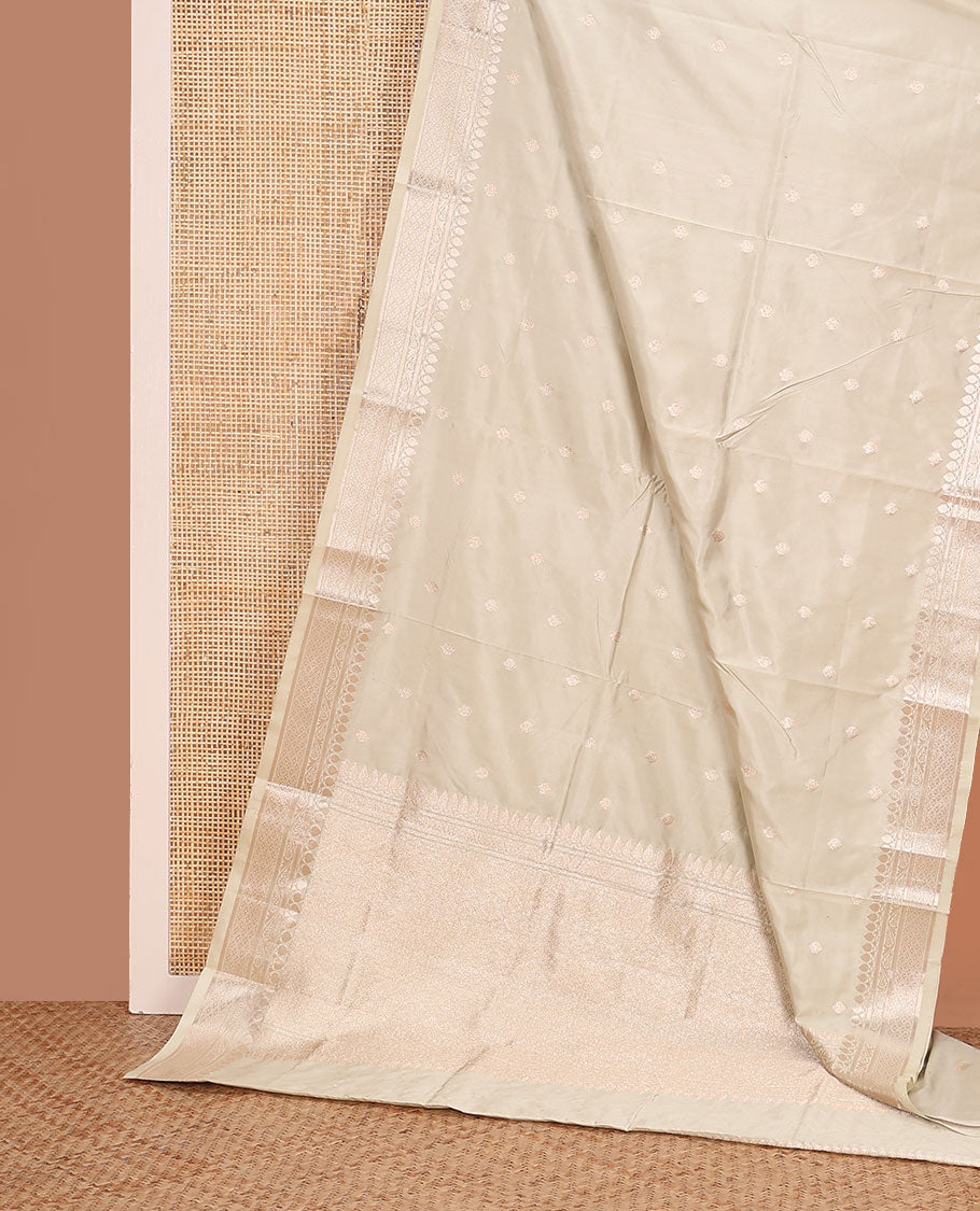 Cream buttas kathan silk saree, traditional zari border, and intricately designed pallu