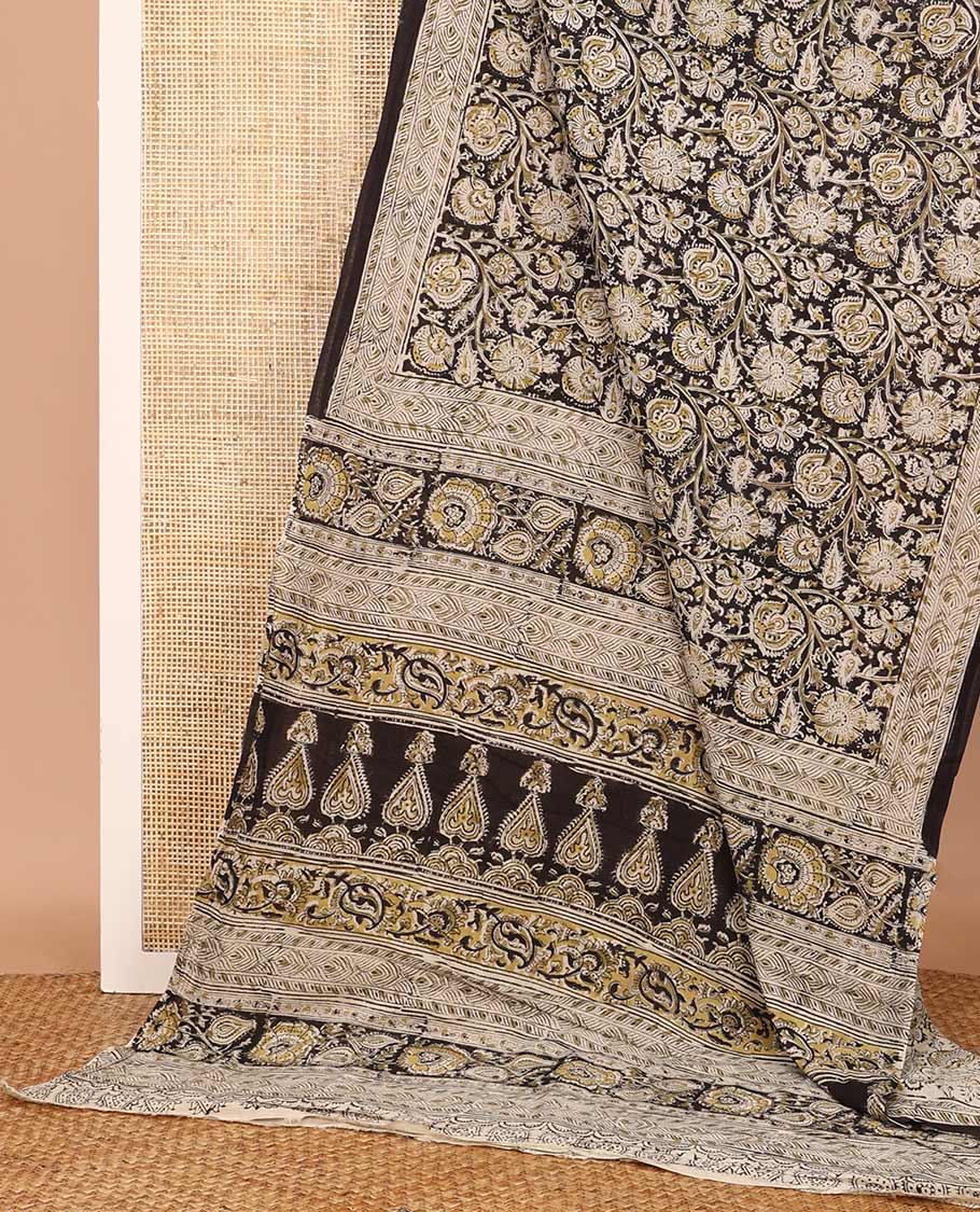Black floral vine machine-printed Kalamkari cotton saree, geometric printed border, and pallu of intricate print