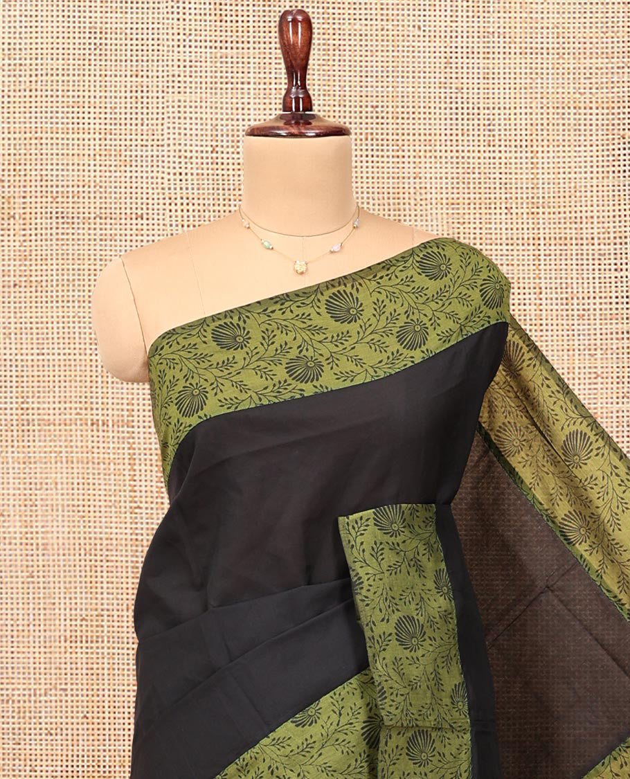 Black Plain Poly Cotton Saree, Complemented by a Contrast Floral-Printed Border, Pallu, and a Contrast Blouse