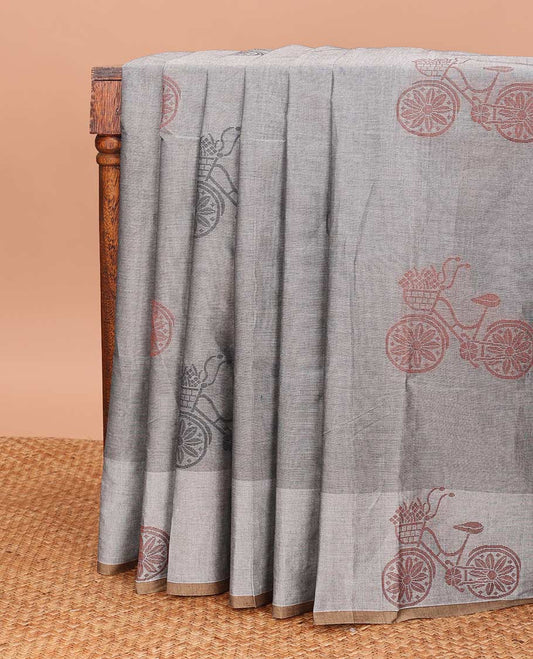 Grey Coimbatore cotton saree with cycle with flower basket motifs, contrast cycle motif border, and pallu of jaal design