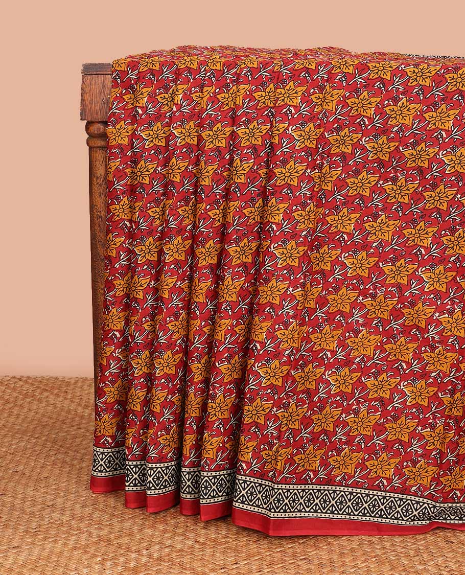 Red floral printed mul mul cotton saree, diamond patterns printed border, and pallu of intricate print