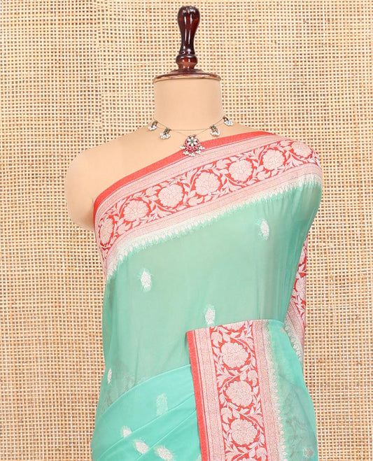 Green Banarasi Georgette Saree, Adorned with Zari Buttas All Over Its Body, Complemented by a Contrast Floral Creeper Design Border, Pallu of Paisleys, and Paired with a Contrast Blouse