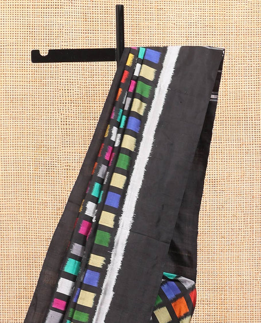 Multi-Color Ikkat Silk Saree, Creatively Woven with Kaleidoscopic-Colored Ikkat Checks on Its Body, Complemented by a Contrast Border, Pallu of Ikkat Buttas, and Paired with a Contrast Blouse