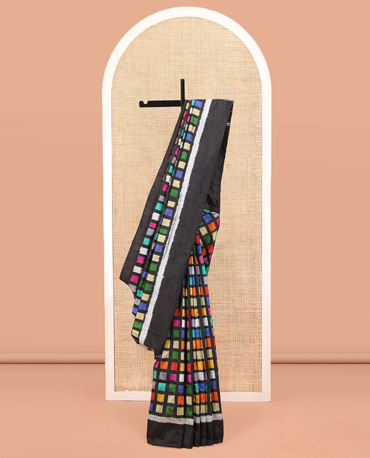 Multi-Color Ikkat Silk Saree, Creatively Woven with Kaleidoscopic-Colored Ikkat Checks on Its Body, Complemented by a Contrast Border, Pallu of Ikkat Buttas, and Paired with a Contrast Blouse