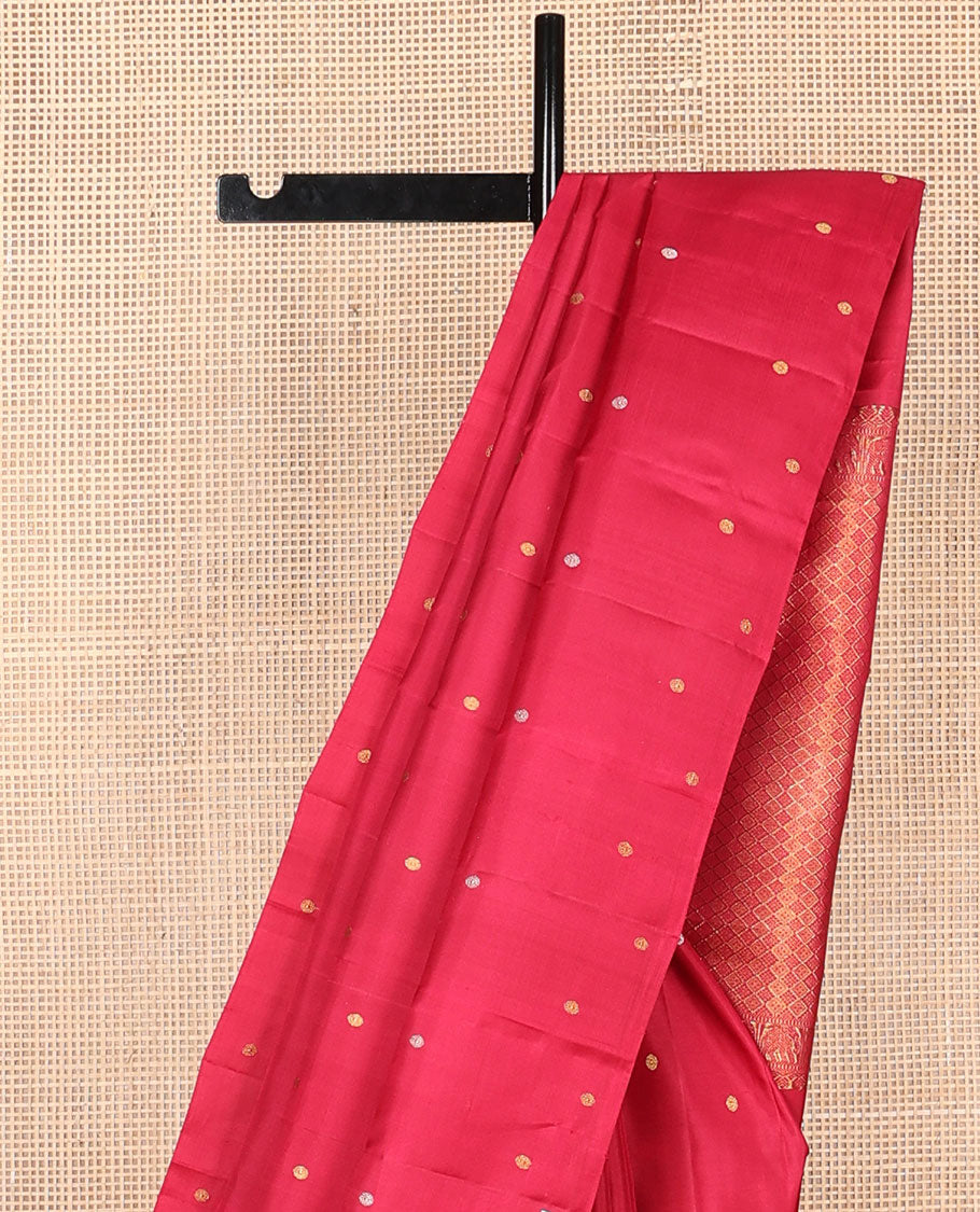 Borderless red poun buttas Kanchipuram silk saree, self-pallu of thilakam mokku, muthu, yaanai & jaal designs