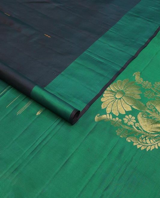 Blue zari buttas Kanchipuram silk saree, contrast leaf motifs zari border, and floral zari design pallu