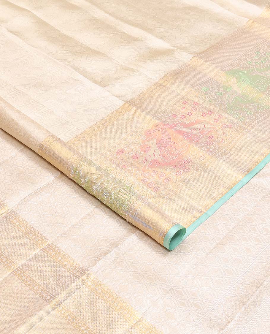 Cream jacquard Kanchipuram silk saree, zari border of mayil kann, and meenakari maan designs, and geometric pallu