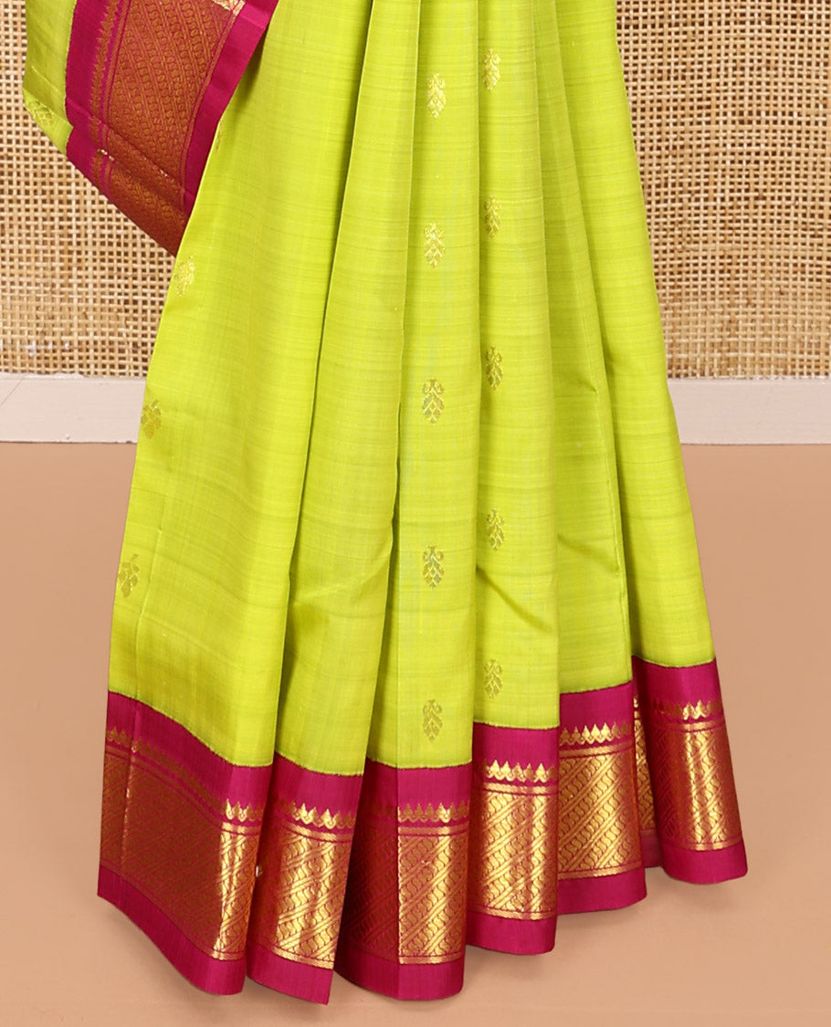 Green Kanchipuram Silk Saree, Meticulously Crafted with Zari Buttas All Over Its Body, Complemented by a Contrast One-Sided Korvai Border of Thilakam Mokku, and Puli Nagam Designs, Pallu of Zari Designs, and Comes Without a Blouse