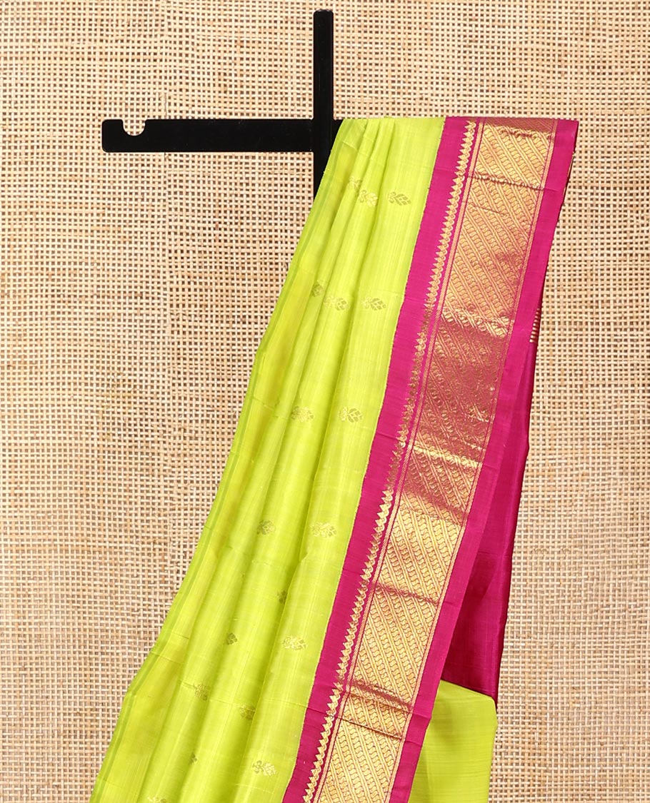 Green Kanchipuram Silk Saree, Meticulously Crafted with Zari Buttas All Over Its Body, Complemented by a Contrast One-Sided Korvai Border of Thilakam Mokku, and Puli Nagam Designs, Pallu of Zari Designs, and Comes Without a Blouse