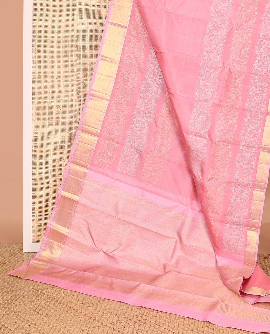 Pink floral motifs woven Kanchipuram designer saree, zari border, and zari-rich jaal pallu