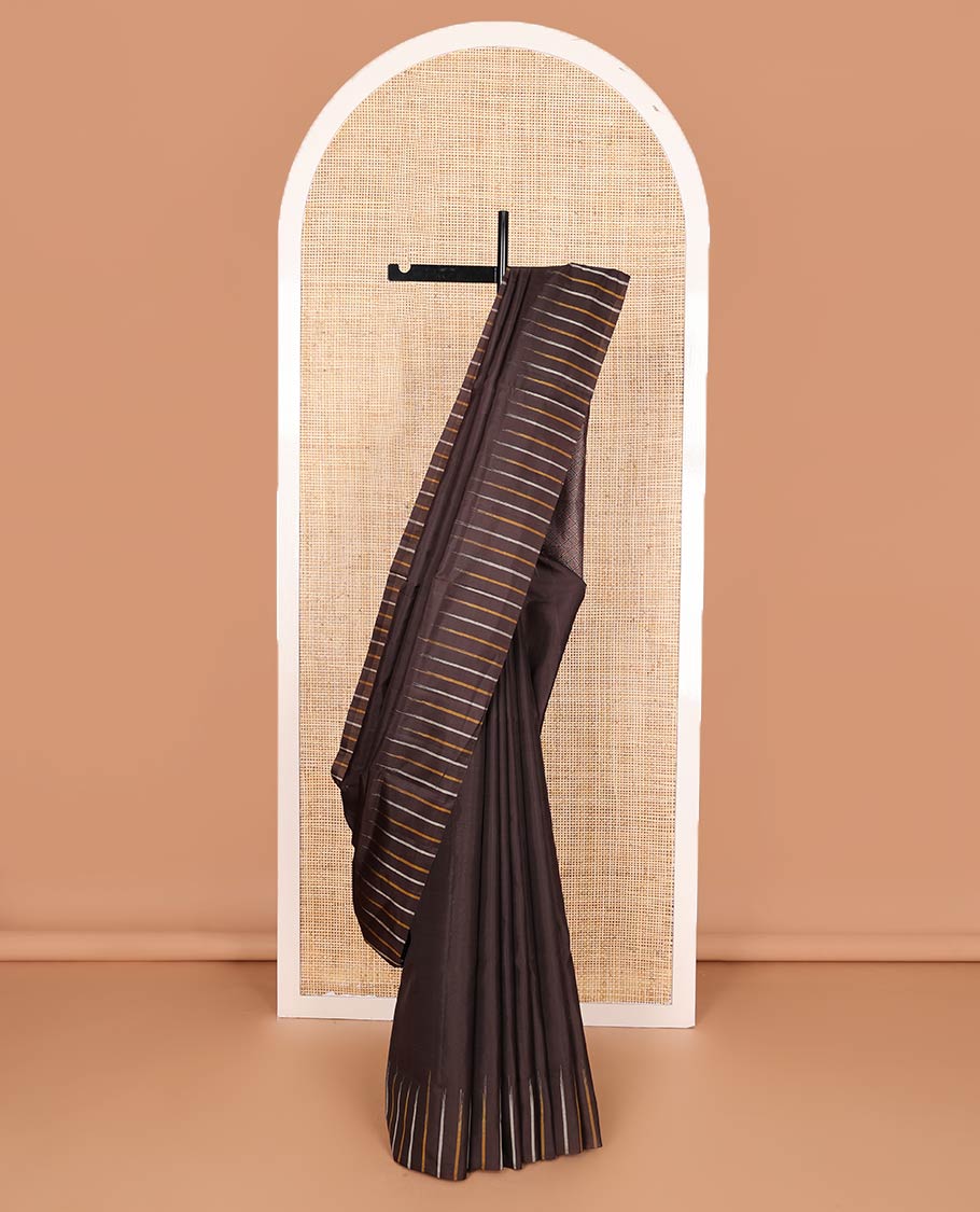 Broderless brown soft silk saree, pallu of thilakam mokku, paisa, kodi visiry, and jaal design