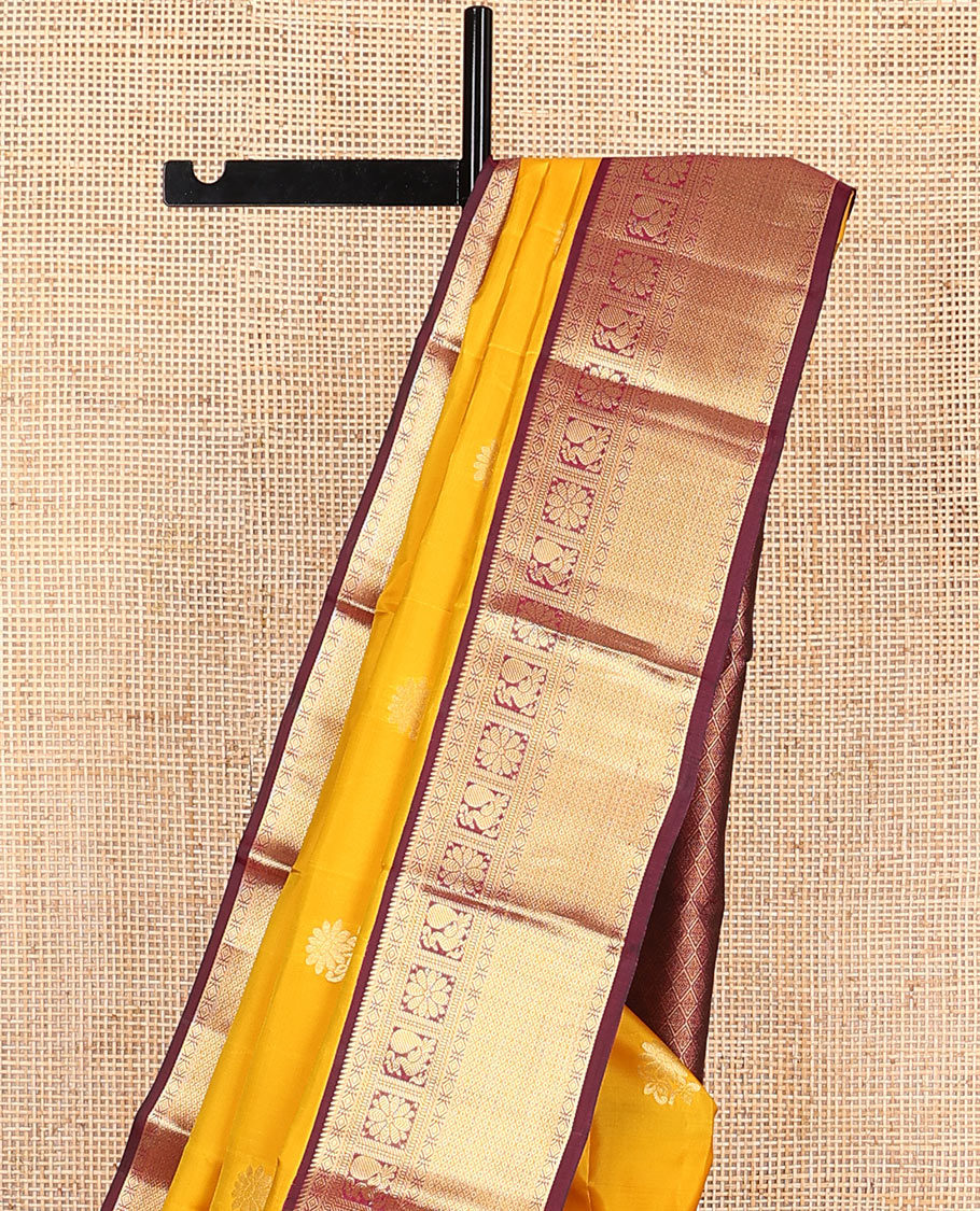 Yellow Vasundhara Lite Silk Mix Saree Dazzled with Zari Buttas, Complemented by a Contrast Border Featuring Rekku, Diamond, Muthu, Mayil, Kamalam, and Mayil Kann Designs, and Zari Elevated Jaal Pallu, and a Contrast Blouse