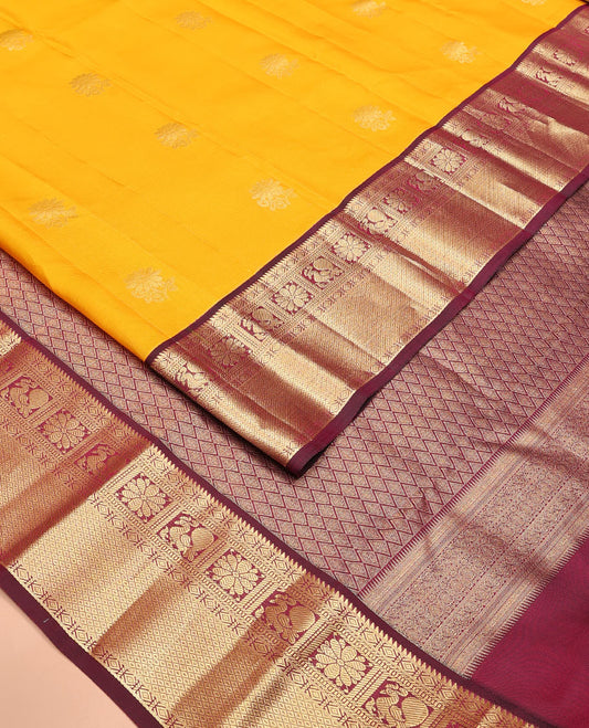 Yellow Vasundhara Lite Silk Mix Saree Dazzled with Zari Buttas, Complemented by a Contrast Border Featuring Rekku, Diamond, Muthu, Mayil, Kamalam, and Mayil Kann Designs, and Zari Elevated Jaal Pallu, and a Contrast Blouse