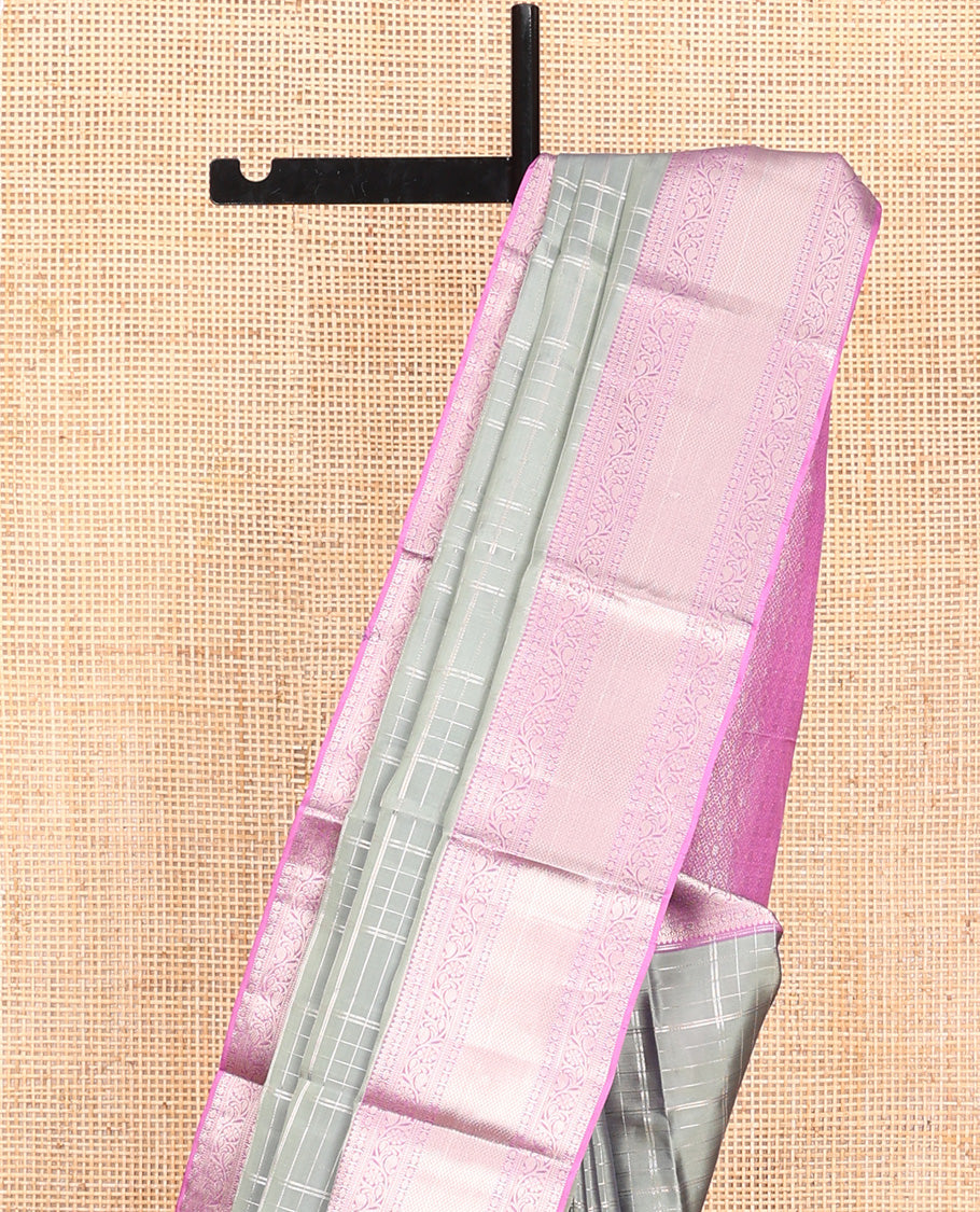 Grey Vasundhara Lite Silk Mix Saree, Gracefully Embellished with Zari Checks On Its Body, Complemented by Contrast Border of Thilakam, Poun, Muthu, Kodi Visiry, and Mayil Kann Designs, Grand Pallu and Paired with a Contrast Blouse