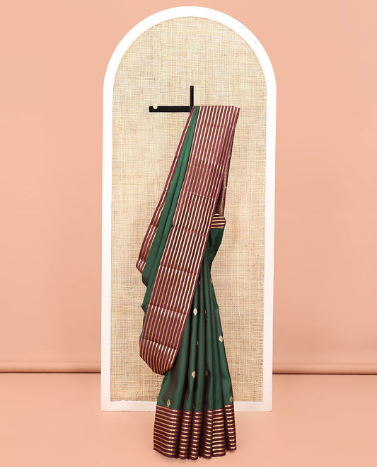 Green Vasundhara Lite Silk Mix Saree, Beautifully Bedecked with Zari Buttas All Over Its Body, Complemented by a Contrast Zari Striped Border, Grand Jaal-Design Pallu, and Paired with a Contrast Blouse