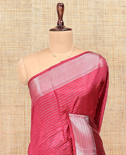 Red Banana Pith Saree, Elevated with Zari Stripes All Over Its Body, Highlighted by Temple Border of Jaal Designs, Subtly Striped Pallu, and Paired with a Matching Blouse