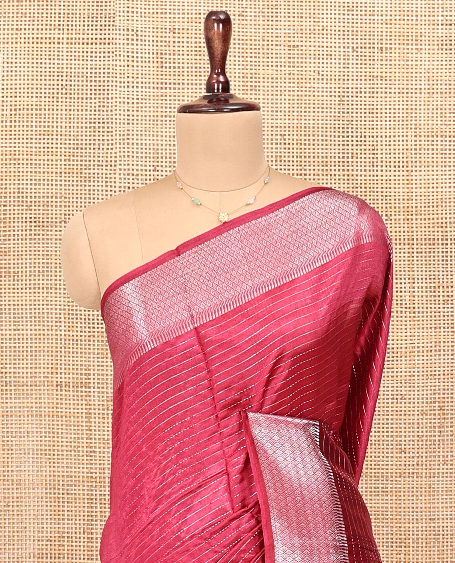 Red Banana Pith Saree, Elevated with Zari Stripes All Over Its Body, Highlighted by Temple Border of Jaal Designs, Subtly Striped Pallu, and Paired with a Matching Blouse