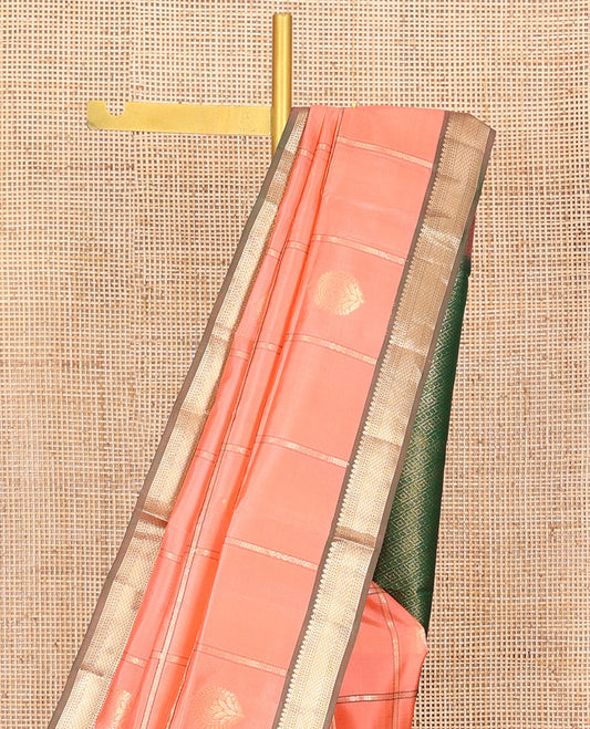 Peach Vasundhara Silk Saree, Mesmerized with Zari Butta Enclosed Checks, Complemented by a Contrast Border of Thilakam Mokku, Neli, Banaras, Muthu, and Mayil Kann Designs, Pallu Depicting Geometric Designs, and Paired with a Contrast Blouse