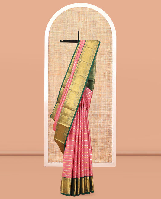 Pink Vasundhara Silk Saree, Embellished with Zari Stripes, a Contrast Border of Jaal, and Chakram Designs, a Diagonally Striped Pallu, and a Contrast Blouse