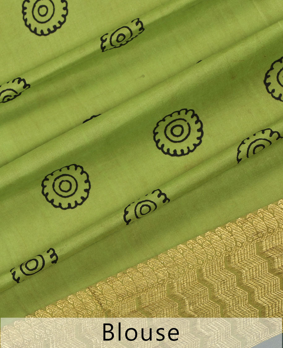 Yellow handpainted pen Kalamkari silk saree with floral design, contrast kanchi border & pallu of intricate floral jaal